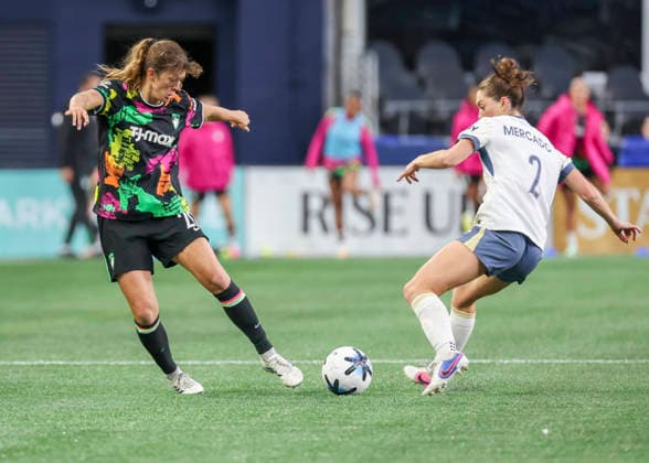 SEATTLE, WA - SEPTEMBER 25: (left to right) Boston Legacy FC defender Nicolette Hernandez (20) and Seattle Reign FC midfielder Maddie Mercado (2) fight for the ball in the second half during the NWSL match between Seattle Reign FC and Boston Legacy FC on September 25, 2026 at Lumen Field in Seattle, Washington. (Photo by Leslie Plaza Johnson Icon Sportswire) SOCCER: SEP 25 NWSL Seattle Reign FC vs Boston Legacy EDITORIAL USE ONLY Icon260925034