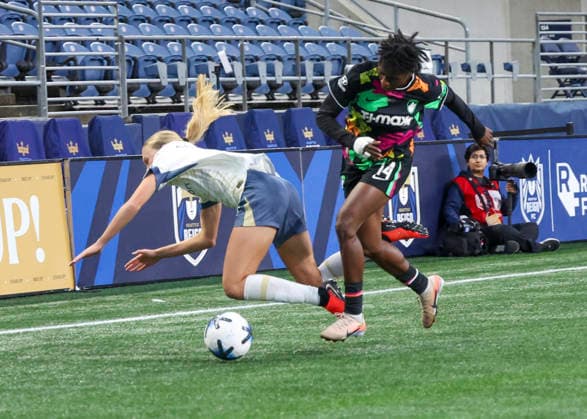 SEATTLE, WA - SEPTEMBER 25: Seattle Reign FC forward Maddie Dahlien (5) goes to the ground after getting tripped by Boston Legacy FC forward AÃ¯ssata TraorÃ (14) in the second half during the NWSL match between Seattle Reign FC and Boston Legacy FC on September 25, 2026 at Lumen Field in Seattle, Washington. (Photo by Leslie Plaza Johnson Icon Sportswire) SOCCER: SEP 25 NWSL Seattle Reign FC vs Boston Legacy EDITORIAL USE ONLY Icon260925040