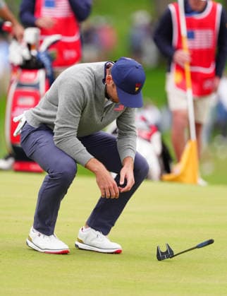 MEDINAH, IL - SEPTEMBER 25: Team USA golfer Sam Burns reacts to missing a putt and losing the match on the 18th hole during the second round of the 2026 Presidents Cup on September 25, 2026, at Medinah Country Club in Medinah, Illinois. (Photo by Brian Spurlock Icon Sportswire) GOLF: SEP 25 Presidents Cup EDITORIAL USE ONLY Icon26092559