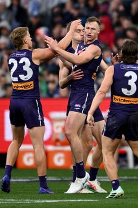 AFL GRAND FINAL, Josh Treacy of the Dockers (centre) celebrates with teammates after kicking a goal during the 2026 AFL Grand Final between the Brisbane Lions and the Fremantle Dockers at the Melbourne Cricket Ground in Melbourne, Saturday, September 26, 2026. ( NO ARCHIVING, EDITORIAL USE ONLY MELBOURNE VICTORIA Australia  Copyright: xJOELxCARRETTx 20260926140415549690