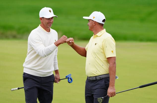 MEDINAH, IL - SEPTEMBER 25: Team International golfer on left Adam Scott gives a fist bump to Christiaan Bezuidenhout on the 2nd hole during the second round of the 2026 Presidents Cup on September 25, 2026, at Medinah Country Club in Medinah, Illinois. (Photo by Brian Spurlock Icon Sportswire) GOLF: SEP 25 Presidents Cup EDITORIAL USE ONLY Icon260925101