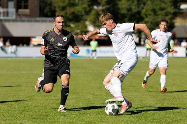Benedikt Kuhn, 24, of TSV Landsberg, and Lukas Schmidt, 17, of SpVgg Ansbach, during the match between TSV Landsberg and SpVgg Ansbach, soccer, men’s, Bavarian Regional League, 2026–2027, Matchday 11 on September 26, 2026, in Landsberg am Lech, Sportpark, Bavaria, Germany