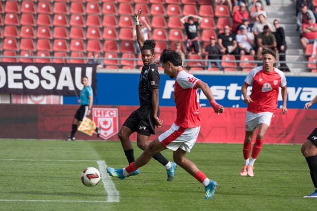 Osman Atilgan (HFC), 10, scores against Charmaine Häusl (Preussen), 21, tying the score at 2–2; Goal, Hallescher FC vs. BFC Preussen 1894 e.V., Soccer, Northeast Regional League, Matchday 11, 2026–27 season, September 26, 2026, Halle Leuna Chemie Stadium, ST Germany