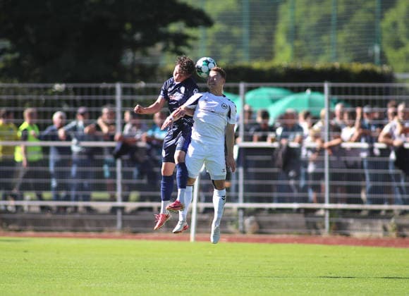 Soccer, Men s, Bavarian Regional League, 2026–2027 Season, SV Wacker Burghausen vs. TSV 1860 Munich, flatbuy Stadium on Liebigstraße; Lance Fiedler (TSV 1860 Munich, left) and Alexander Gordok (SV Wacker Burghausen, right) battle for the ball in a header duel