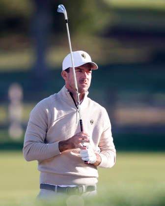 International team player Nick Taylor of Canada watches his second shot from the fairway on the second hole during the third round of the 2026 President s Cup golf tournament at Medinah Country Club in Chicago, Illinois, on Saturday, September 26, 2026.  CHI20260926706 TANNENxMAURY