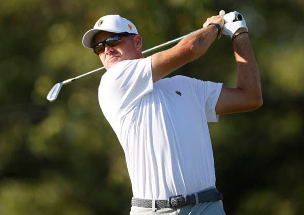 International team player Corey Conners of Canada tees off on the fourth hole in a four-ball match during the third round of the 2026 President s Cup golf tournament at Medinah Country Club in Chicago, Illinois, on Saturday, September 26, 2026.  CHI20260926714 TANNENxMAURY