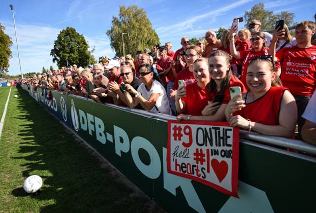 Soccer: DFB Women s Cup, First Round, 2026–2027 Season, September 26, 2026: SV Eutingen vs. FC Carl Zeiss Jena. About 1,200 spectators at the sports complex in Eutingen; fans of Lene Berner holding a poster