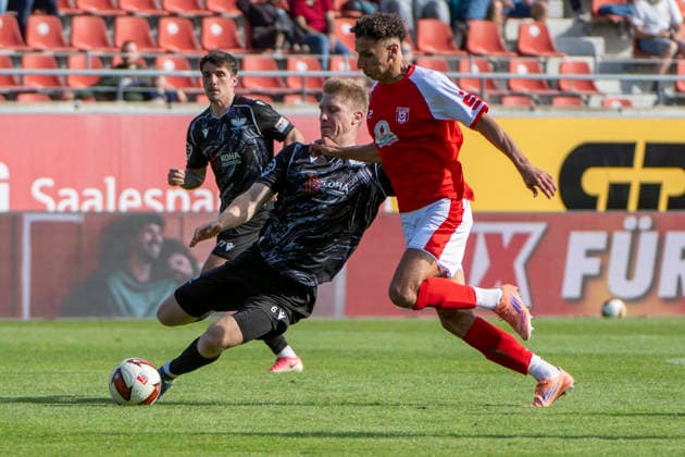 Regionalliga Northeast Season 26-27 Hallescher FC vs. BFC Preussen Berlin 1894 e.V. Halle, Germany September 26, 2026 Pictured from left: Lucas Vierling (Berlin) and Soufian Benyamina (Halle) in a tackle at the Halle Saale Leuna Chemie Stadium, Saxony-Anhalt, Germany