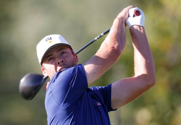 Sam Burns of the United States tees off on the fourth hole in a four-ball match during the third round of the 2026 President s Cup golf tournament at Medinah Country Club in Chicago, Illinois, on Saturday, September 26, 2026.  CHI20260926715 TANNENxMAURY