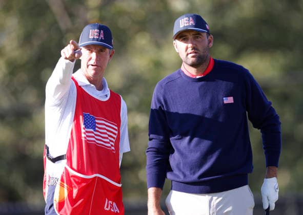 Scottie Scheffler of the United States and caddie Ted Scott line up a drive on the fourth tee in a four-ball match during the third round of the 2026 President s Cup golf tournament at Medinah Country Club in Chicago, Illinois, on Saturday, September 26, 2026.  CHI20260926718 TANNENxMAURY