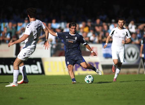 Soccer, Men s, Bavarian Regional League, 2026–2027 Season, SV Wacker Burghausen vs. TSV 1860 Munich, flatbuy Stadium on Liebigstraße, Tunay Deniz of TSV 1860 Munich taking a shot on goal, ball, shot