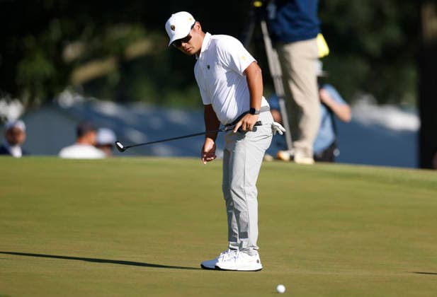 International team player Ryo Hisatsune of Japan watches his putt on the sixth hole in a four-ball match during the third round of the 2026 President s Cup golf tournament at Medinah Country Club in Chicago, Illinois, on Saturday, September 26, 2026.  CHI20260926742 TANNENxMAURY