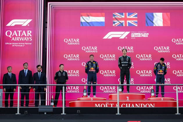 BAKU, AZERBAIJAN - SEPTEMBER 26: George Russell of Great Britain and Mercedes-AMG PETRONAS F1 Team (1st) Max Verstappen of the Netherlands and Oracle Red Bull Racing (2nd) and Isack Hadjar of France and Oracle Red Bull Racing (3rd) during anthens on podium after finishing second and third in the F1 Grand Prix of Azerbaijan at Baku City Circuit on September 26, 2026 in Baku, Azerbaijan. (Photo by Qian Jun SPP-Paddocker) Copyright: xQianxJun SPP-Paddockerx Sportspressphoto_SPR240064