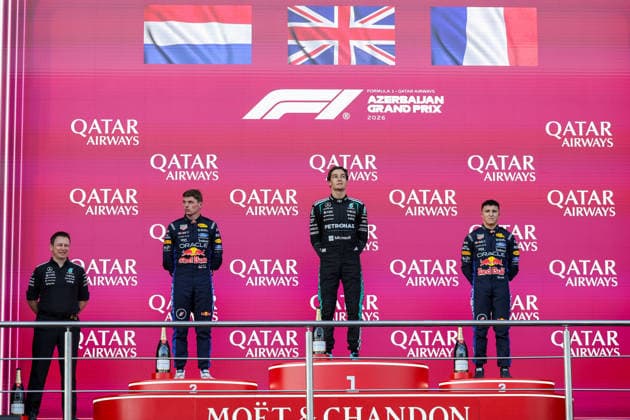 BAKU, AZERBAIJAN - SEPTEMBER 26: George Russell of Great Britain and Mercedes-AMG PETRONAS F1 Team (1st) Max Verstappen of the Netherlands and Oracle Red Bull Racing (2nd) and Isack Hadjar of France and Oracle Red Bull Racing (3rd) during anthens on podium after finishing second and third in the F1 Grand Prix of Azerbaijan at Baku City Circuit on September 26, 2026 in Baku, Azerbaijan. (Photo by Qian Jun SPP-Paddocker) Copyright: xQianxJun SPP-Paddockerx Sportspressphoto_SPR240066