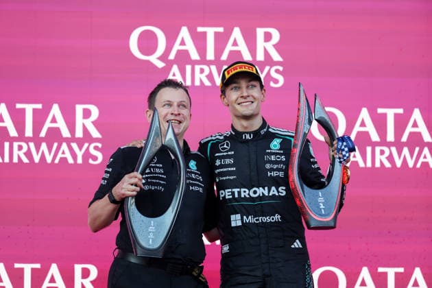 BAKU, AZERBAIJAN - SEPTEMBER 26: Race winner George Russell of Great Britain and Mercedes-AMG PETRONAS F1 Team and George Russell of Great Britain and Chris Nelson, Trackside Control Systems Engineer, Mercedes-AMG PETRONAS F1 Team celebrate with trophies on podium after the F1 Grand Prix of Azerbaijan at Baku City Circuit on September 26, 2026 in Baku, Azerbaijan. (Photo by Qian Jun SPP-Paddocker) Copyright: xQianxJun SPP-Paddockerx Sportspressphoto_SPR240095