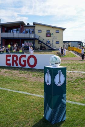 September 25, 2026, Soccer, 1st Round of the 2026–2027 DFB Women’s Cup, SG 99 Andernach vs. SC Freiburg. DFB Cup ball display featuring the match ball before the game. In the background, the children leading the players onto the field are already standing by.