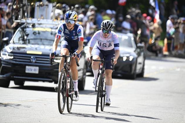 French Lea Curinier and American Natalie Quinn are pictured in action during the elite women Road Race race (180,4 km) at the cycling World Championship, WM, Weltmeisterschaft in Montreal, Canada, Saturday 26 September 2026. The UCI road world championships are taking place from 20 to 27 September, in Montreal, Canada. JASPERxJACOBS  x187902709x