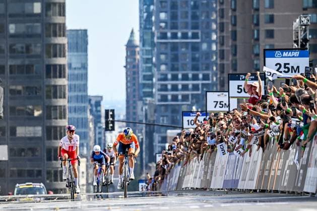 Dutch Demi Vollering celebrates as she crosses the finish line to win the elite women Road Race race (180,4 km) at the cycling World Championship, WM, Weltmeisterschaft in Montreal, Canada, Saturday 26 September 2026. The UCI road world championships are taking place from 20 to 27 September, in Montreal, Canada. JASPERxJACOBS  x187909238x