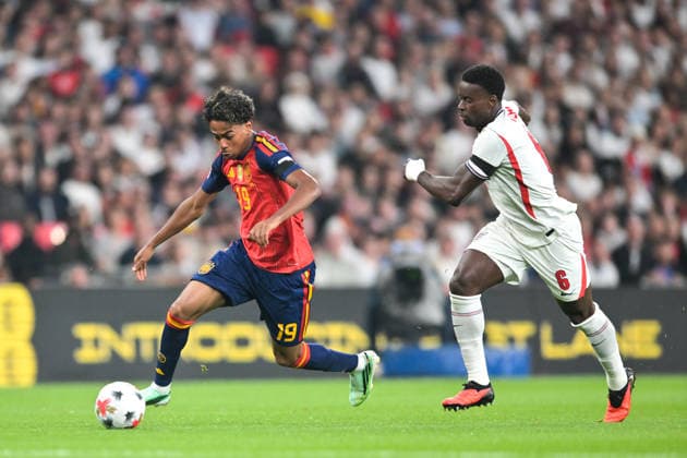 Lamine Yamal of Spain takes the ball away from Marc Guehi of England during the Nations League match between England and Spain at Wembley Stadium, London, England on 26 September 2026. Copyright: xPhilxHutchinsonx 45460005