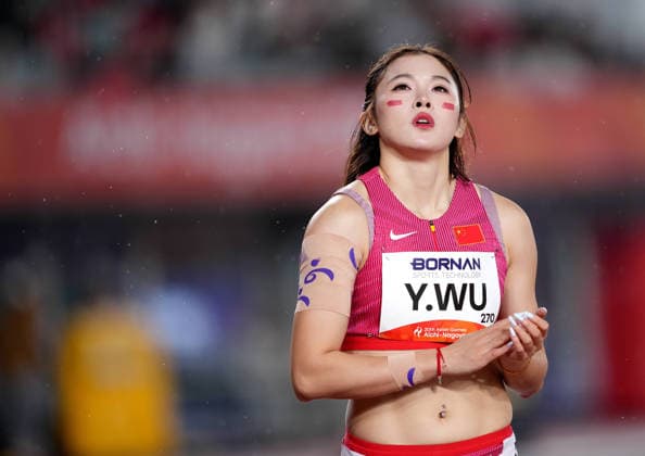 (260926) -- NAGOYA, Sept. 26, 2026 -- Wu Yanni of China reacts after the women s 100m hurdles round 1 match of Athletics at the 20th Asian Games Aichi-Nagoya 2026 in Nagoya, Japan, Sept. 26, 2026. ) (SP)JAPAN-NAGOYA-ASIAN GAMES-ATHLETICS-WOMEN S 100M HURDLES LuoxYuan 