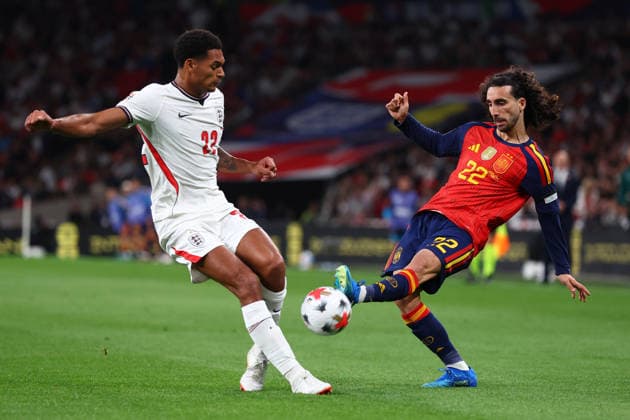 London, England, 26th September 2026. Jarell Quansah of England and Marc Cucurella of Spain challenge for the ball during the England vs Spain UEFA Nations League match at Wembley Stadium, London. Picture credit should read: Paul Terry Sportimage EDITORIAL USE ONLY. No use with unauthorised audio, video, data, fixture lists, club league logos or live services. Online in-match use limited to 120 images, no video emulation. No use in betting, games or single club league player publications. SPI_174_PT_England_Spain SPI-5020-0173