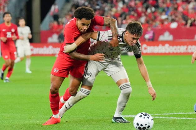 September 26, 2026, Toronto, On, CAN: Canada s Tajon Buchanan, left, battles for the ball with Chile s Ivan Roman during an international soccer friendly in Toronto on Sept. 26, 2026. Canada News - September 26, 2026  - ZUMAc35_ 20260926_zaf_c35_128 Copyright: xChrisxYoungx
