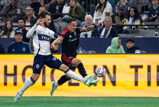 September 26, 2026, Vancouver, Bc, CANADA: Vancouver Whitecaps Tristan Blackmon (left) and D.C. United s Joao Peglow (7) vie for the ball during the first half of an MLS, Fussball Herren, USA soccer match, in Vancouver, on Saturday, Sept. 26, 2026. Canada News - September 26, 2026  - ZUMAc35_ 20260926_zaf_c35_203 Copyright: xJacobxMallarix