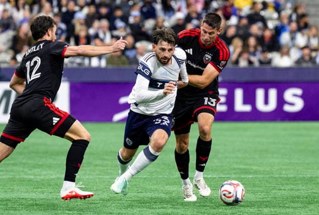 September 26, 2026, Vancouver, Bc, CANADA: Vancouver Whitecaps Tristan Blackmon (centre) moves the ball between D.C. United s Sean Nealis (13) and Conner Antley (12) during the second half of an MLS, Fussball Herren, USA soccer match, in Vancouver, on Saturday, Sept. 26, 2026. Canada News - September 26, 2026  - ZUMAc35_ 20260926_zaf_c35_215 Copyright: xJacobxMallarix