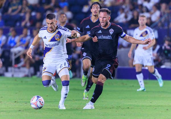September 26, 2026, Carson, California, USA: Erik Thommy 27 of the LA Galaxy and Keegan Rosenberry 2 of the Colorado Rapids struggle for possession of the ball during their regular season MLS, Fussball Herren, USA game on Saturday September 26, 2026 at the Dignity Health Sports Park Stadium in Carson, California. Galaxy defeat Rapids, 3-2. ARIANA RUIZ PI LA Galaxy Vs. Rapids  - ZUMAp124 20260926_zaa_p124_019 Copyright: xArianaxRuizx