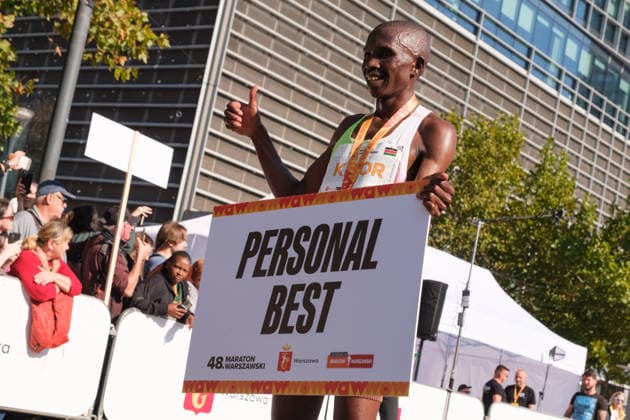 September 27, 2026, Warsaw, Masovian Voivodeship, Poland: STEPHEN KIBOR of Kenya holds up a personal best record sign at the finish line after placing first in the 48th Warsaw Marathon. The race has been awarded the World Athletics Elite Label for the first time in its history and is part of the European Marathon Classics (EMC) series of races. Warsaw Marathon 2026  - ZUMAk204 20260927_zip_k204_021 Copyright: xRomanxKozielx