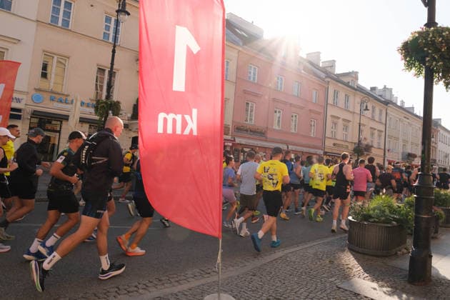 September 27, 2026, Warsaw, Masovian Voivodeship, Poland: Athletes run past the 1km mark during the 48th Warsaw Marathon. The race has been awarded the World Athletics Elite Label for the first time in its history and is part of the European Marathon Classics (EMC) series of races. Warsaw Poland - ZUMAk204 20260927_zip_k204_010 Copyright: xRomanxKozielx