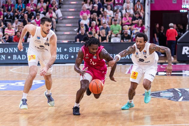 easyCredit Basketball Bundesliga, Telekom Baskets Bonn vs. SYNTAINICS MBC, September 27, 2026: John Michael Wright (Telekom Baskets Bonn) 1 vs. Jure Planinic (SYNTAINICS MBC) 44 and DeLonnie Hunt (SYNTAINICS MBC) 3; easyCredit Basketball Bundesliga, Telekom Baskets Bonn vs. Syntainics MBC, September 27, 2026, Telekom Dome Bonn Copyright: xBEAUTIFULxSPORTS Derixx