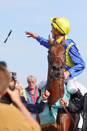 September 27, 2026, Cologne, North Rhine-Westphalia, GER Jockey Christophe Soumillon throws his whip into the crowd after winning the 64th Prix de l Europe on Goliath at the Cologne Weidenpesch Racetrack Horse, Jockey, Goliath, Soumillon, victory, whip, throw 260927SG994KOELN JPG