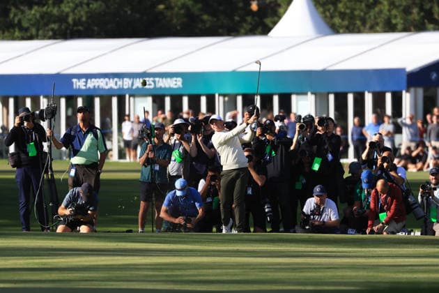 RECORD DATE NOT STATED 20th September 2026; Wentworth Golf Club, Virginia Water, Surrey, England; DP World Tour Golf, BMW PGA, Golf Herren Championship, Final Day; Rory McIlroy of Northern Ireland decides plays an iron shot into the 18th green with photographers behind him JeremyxGowers-Cromie