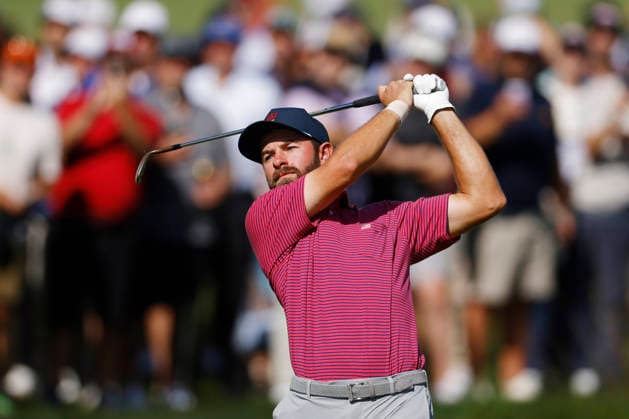 Cameron Young of the United States hits from the fairway on the second hole during a singles match on the final day of the 2026 President s Cup golf tournament at Medinah Country Club in Chicago, Illinois, on Sunday, September 27, 2026.  CHI20260927714 TANNENxMAURY