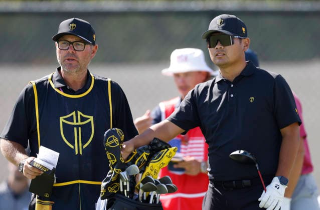 International team player Ryo Hisatsune of Japan talks with his caddie before teeing off on the fourth hole during a singles match on the final day of the 2026 President s Cup golf tournament at Medinah Country Club in Chicago, Illinois, on Sunday, September 27, 2026.  CHI20260927718 TANNENxMAURY
