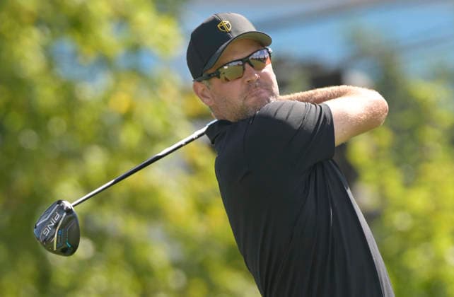 International team player Corey Conners of Canada tees off on the third hole during a singles match on the final day of the 2026 President s Cup golf tournament at Medinah Country Club in Chicago, Illinois, on Sunday, September 27, 2026.  CHI20260927723 MARKxBLACK
