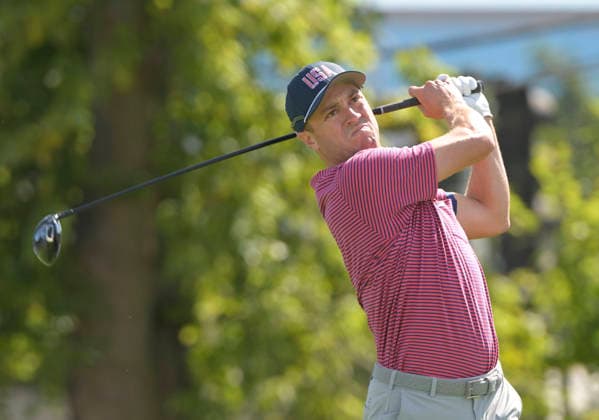 Justin Thomas of the United States tees off on the third hole during a singles match on the final day of the 2026 President s Cup golf tournament at Medinah Country Club in Chicago, Illinois, on Sunday, September 27, 2026.  CHI20260927724 MARKxBLACK