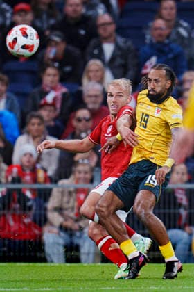 Nations League: Denmark vs. Wales—Denmark s Gustav Isaksen and Wales Sorba Thomas during the Nations League match between Denmark and Wales at Parken on Sunday, September 27, 2026. Photo by Liselotte Sabroe, Ritzau Scanpix, Copenhagen, Denmark  Copyright: Ritzau Scanpix LiselottexSabroex spdk20260927-202432-L
