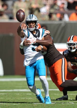 Carolina Panthers quarterback Bryce Young (9) is hit by Cleveland Browns Jared Verse (8) as he throws the ball during the first quarter at Huntington Bank Field in Cleveland, Ohio on Sunday September 27, 2026.  CLE20260927108 AARONxJOSEFCZYK