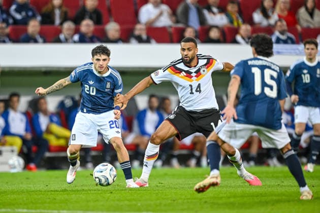Christos Zafeiris (Greece), Josha Vagnoman of Germany and Thanasis Androutsos of Greece battle for the ball during the UEFA Nations League 2026–27 group stage match between Germany and Greece at WWK Arena on September 27, 2026, in Augsburg, Germany. Photo by Harry Langer, DeFodi Images