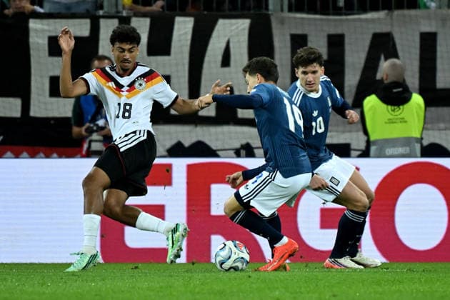 September 27, 2026, xemx, Soccer, UEFA Nations League, Germany vs. Greece, Nathaniel Brown, German National Soccer Team (DFB), Konstantinos Karetsas, Greece, tackle, action, battle for the ball, Augsburg