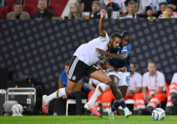 Tackle, Action: Josha Vagnoman (GER 14) vs. Andreas Tetteh (GRE 16) – DFB International Match: Germany (GER) vs. Greece (GRE) – UEFA Nations League on September 27, 2026. DFL regulations prohibit any use of photographs as image sequences and or QUASI-VIDEO DFB International Match: Germany (GER) vs. Greece (GRE), UEFA Nations League