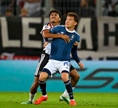 September 27, 2026, Soccer: 2026–2027 UEFA Nations League, Matchday 2, Germany vs. Greece, at the WWK Arena in Augsburg; from left: Nathaniel Brown (Germany) vs. Konstantinos Karetsas (Greece)