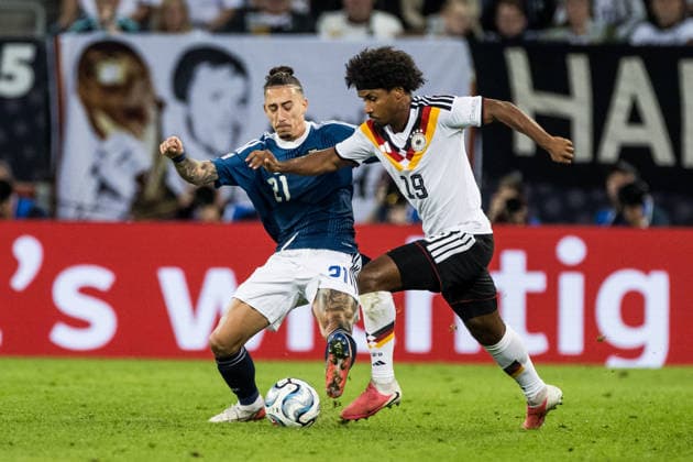 AUGSBURG, GERMANY - SEPTEMBER 27: Karim Adeyemi (Germany, 19) controls the ball against Kostas Tsimikas (Greece, 21) during the UEFA Nations League match between Germany vs. Greece at WWK Arena on matchday 2 of the UEFA Nations League on September 27, 2026 in Augsburg, Germany. Bavaria Germany Copyright: xSteffiexWunderlx