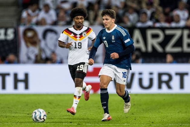 AUGSBURG, GERMANY - SEPTEMBER 27: Christos Tzolis (Greece, 10) controls the ball against Karim Adeyemi (Germany, 19) during the UEFA Nations League match between Germany vs. Greece at WWK Arena on matchday 2 of the UEFA Nations League on September 27, 2026 in Augsburg, Germany. Bavaria Germany Copyright: xSteffiexWunderlx