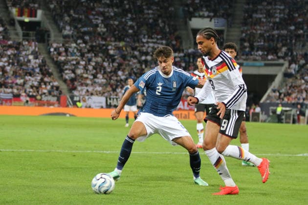 September 27, 2026 Men s Soccer 2026–2027 UEFA Nations League Matchday 2 Germany vs. Greece WWK Arena, Augsburg Kevin Schade (Germany, No. 9, white) is in possession of the ball ahead of Giorgos Vagiannidis (Greece, No. 2, blue) Augsburg, Bavaria, Germany