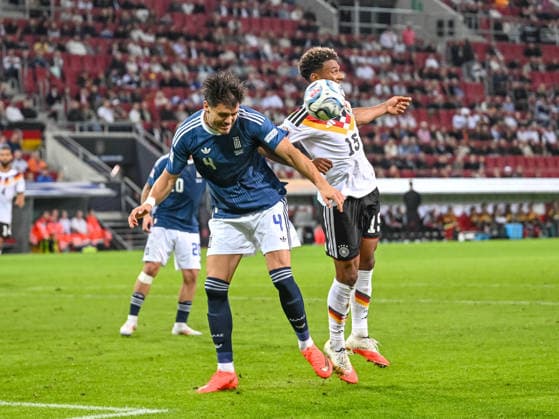 Ntinos Mavropanos of Greece and Bambase Conte of Germany battle for the ball during the UEFA Nations League 2026-27 group stage match between Germany and Greece at WWK Arena on September 27, 2026, in Augsburg, Germany. Photo by Harry Langer, DeFodi Images