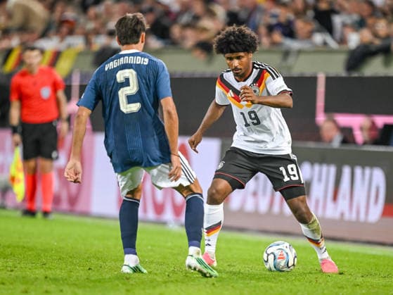 Giorgos Vagiannidis of Greece and Karim Adeyemi of Germany battle for the ball during the UEFA Nations League 2026–27 group stage match between Germany and Greece at WWK Arena on September 27, 2026, in Augsburg, Germany. Photo by Harry Langer, DeFodi Images