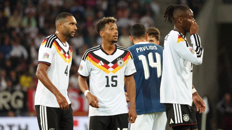 September 27, 2026, xrekx, Soccer, UEFA Nations League, Germany vs. Greece: Jonathan Tah (Germany), BambasÃ ContÃ (Germany), and Yann Bisseck (Germany) received a yellow card in Augsburg